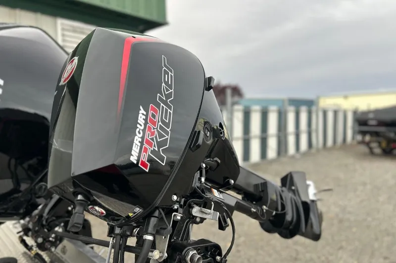 Slide: The Image of Mercury Pro Kicker engine on 2026 Thunder Jet 22 Chinook OS boat, outdoor setting. - 11