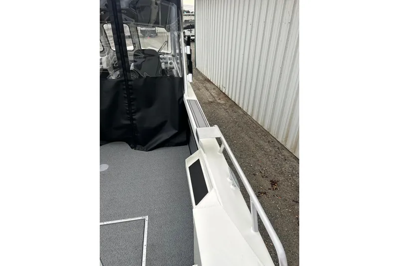 Slide: The Image of 2026 Thunder Jet 22 Chinook OS boat with covered cockpit and sleek design. - 16