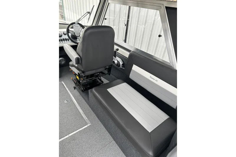Slide: The Image of Interior of 2026 Thunder Jet 22 Chinook OS boat with seating and steering wheel. - 28