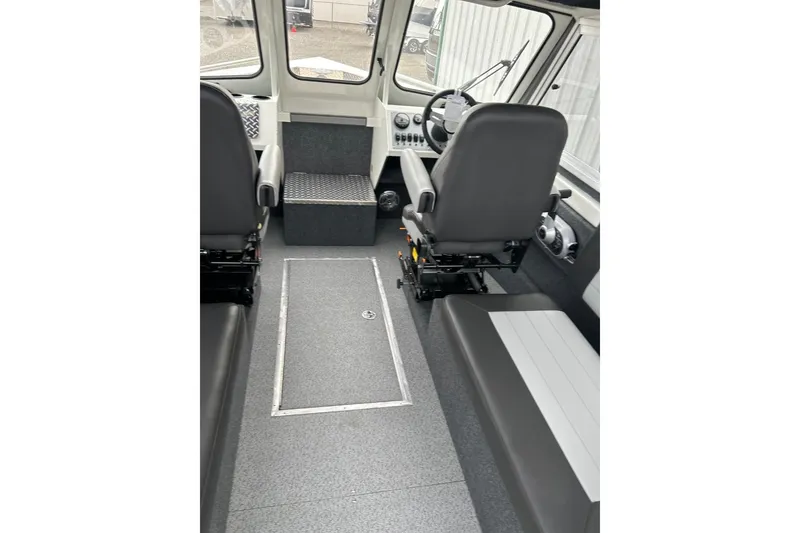 Slide: The Image of Interior of 2026 Thunder Jet 22 Chinook OS boat with seating and steering console. - 29