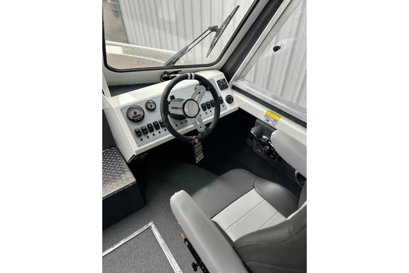 Slide: The Image of 2026 Thunder Jet 22 Chinook OS boat interior with steering wheel and control panel. - 31