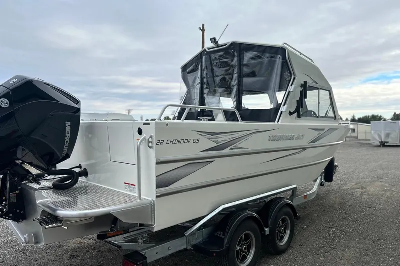 Slide: The Image of 2026 Thunder Jet 22 Chinook OS boat on trailer, featuring sleek design and powerful engine. - 4