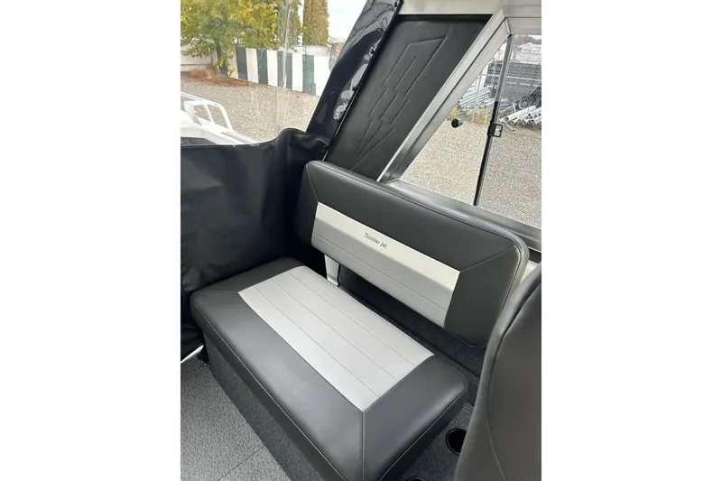 Slide: The Image of Interior seating of 2026 Thunder Jet 22 Chinook OS boat, featuring sleek gray upholstery. - 47
