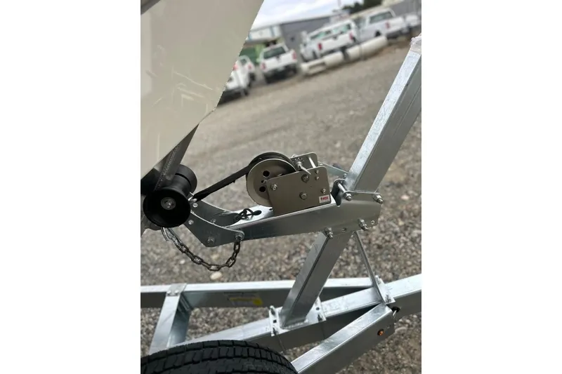 Slide: The Image of Trailer hitch of 2026 Thunder Jet 22 Chinook OS boat on gravel surface. - 51