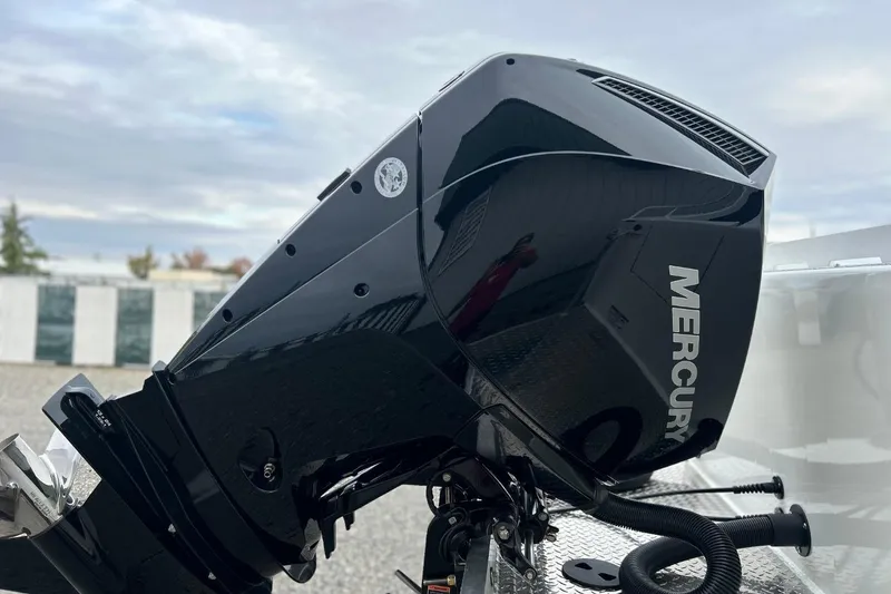 Slide: The Image of 2026 Thunder Jet 22 Chinook OS with Mercury outboard motor, sleek design, outdoor setting. - 6