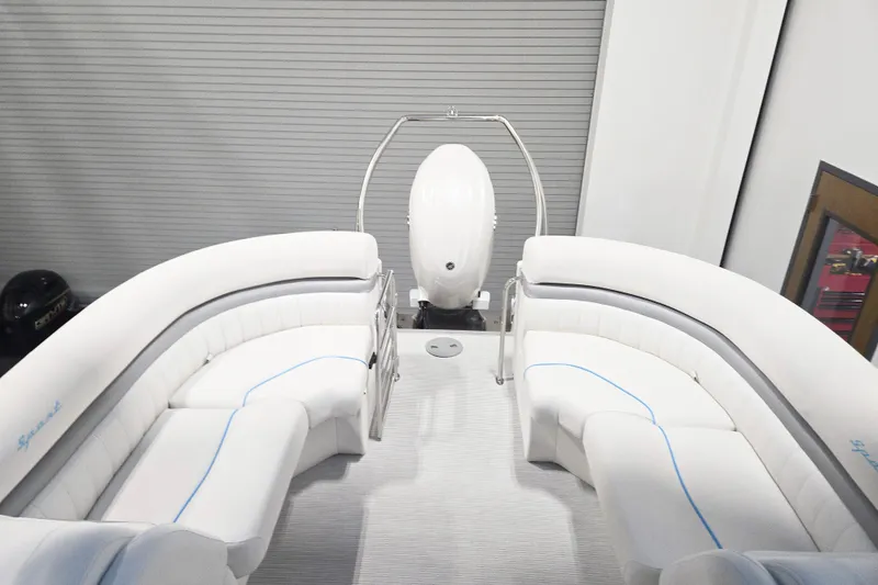 Slide: The Image of 2026 Bennington 24 LXS FASTBACK SPORT ARCH interior with white seating and modern design. - 11