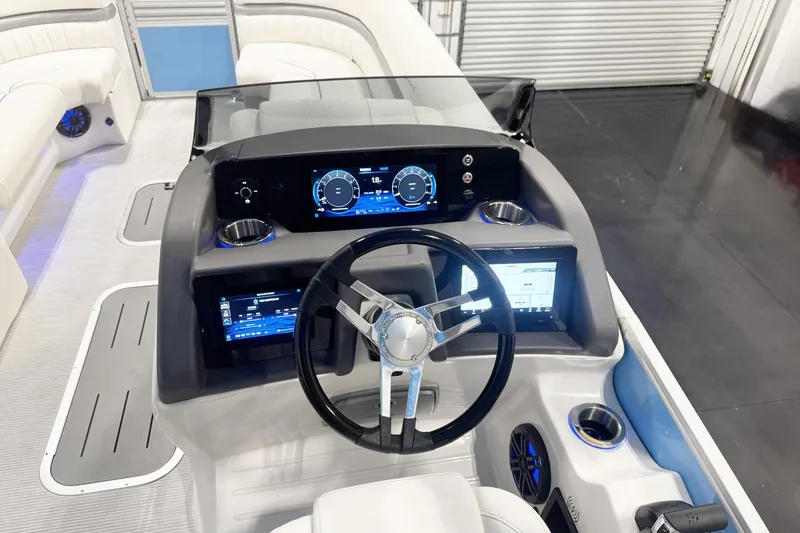 Slide: The Image of 2026 Bennington 24 LXS FASTBACK SPORT ARCH boat dashboard with modern controls and steering wheel. - 9