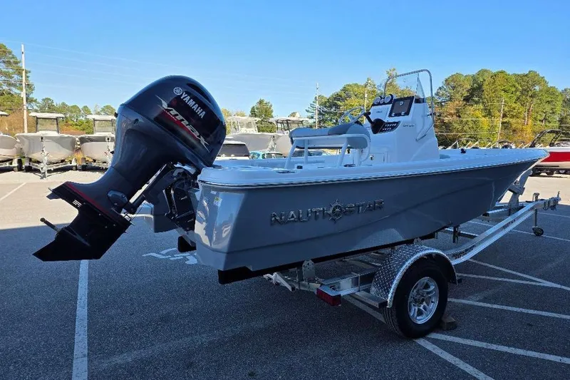 Slide: The Image of 2026 NauticStar 194 Bay boat with Yamaha outboard motor on a trailer. - 4