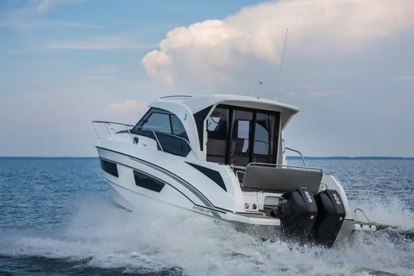 Slide: The Image of 2024 Beneteau Antares 9 motorboat cruising on open water. - 2
