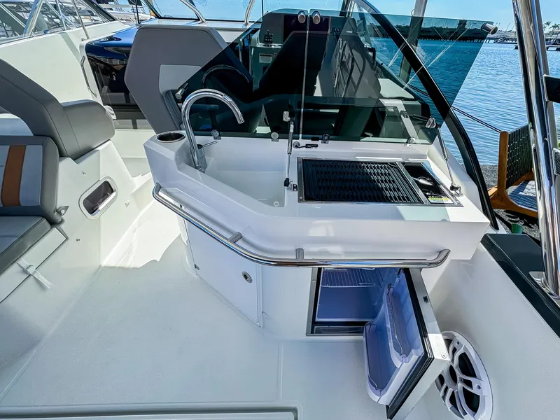 Slide: The Image of 2024 Beneteau Flyer 10 boat interior with kitchenette and seating area. - 6