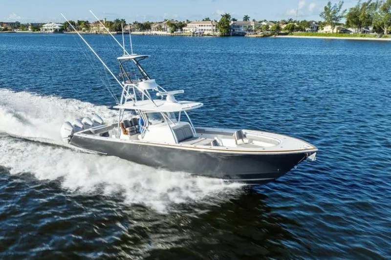 The Image of 2020 Valhalla Boatworks V-41 cruising on a serene lake under clear skies. - 0