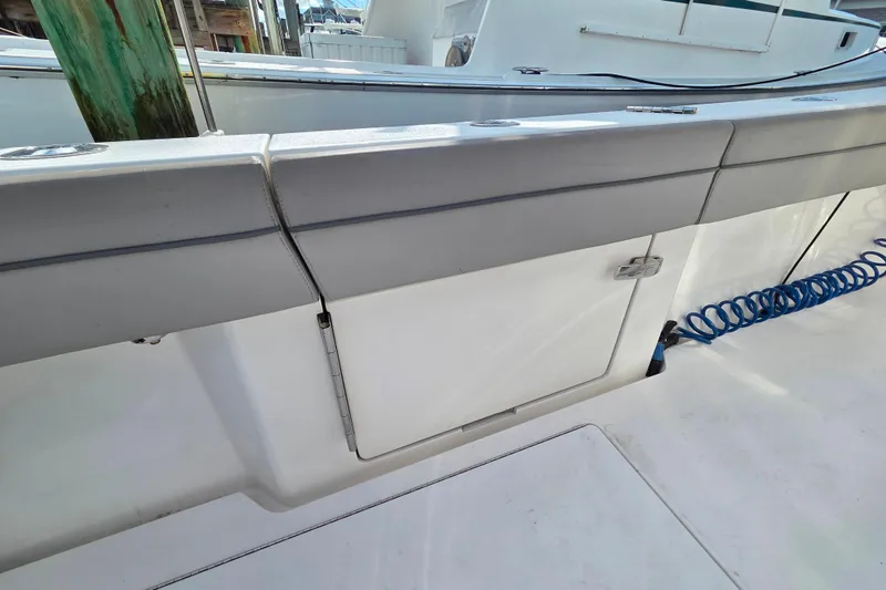 Slide: The Image of 2020 Valhalla Boatworks V-41 deck with storage compartment and coiled hose. - 7