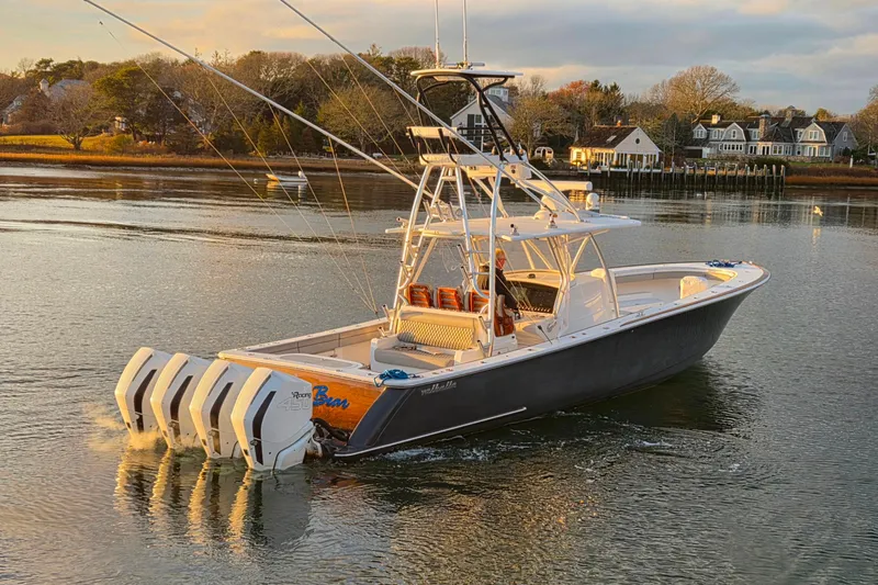 Slide: The Image of 2020 Valhalla Boatworks V-41 in scenic harbor, featuring four powerful outboard engines. - 3