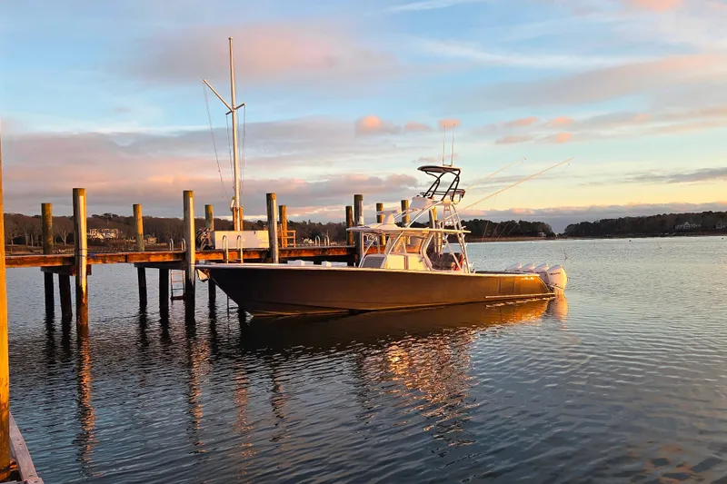 Slide: The Image of 2020 Valhalla Boatworks V-41 docked at sunset, calm waters reflecting the sky. - 11