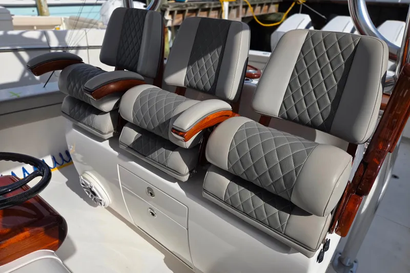 Slide: The Image of Luxurious seating on 2020 Valhalla Boatworks V-41 with quilted upholstery and wooden accents. - 5