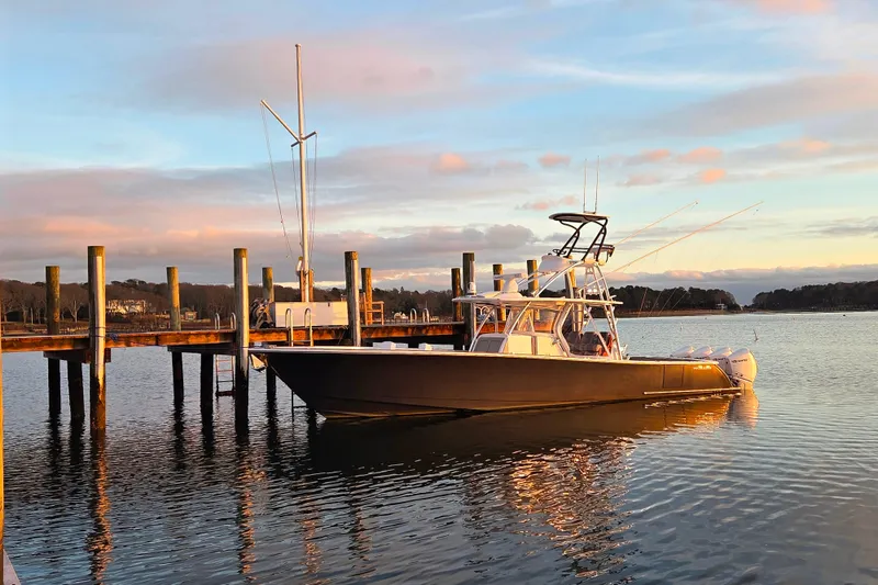 Slide: The Image of 2020 Valhalla Boatworks V-41 docked at sunset, reflecting on calm water. - 13