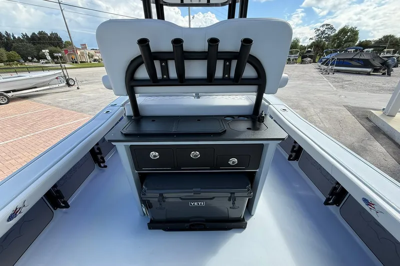 Slide: The Image of 2026 Crevalle 26 HCO boat interior with rod holders and storage compartments. - 11