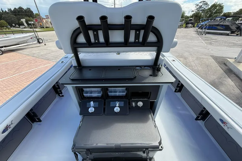 Slide: The Image of 2026 Crevalle 26 HCO boat interior with storage compartments and rod holders. - 12