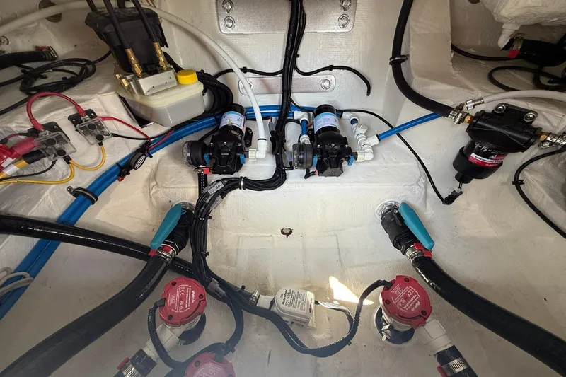 Slide: The Image of 2026 Crevalle 26 HCO boat wiring and plumbing system, showcasing pumps and cables. - 27