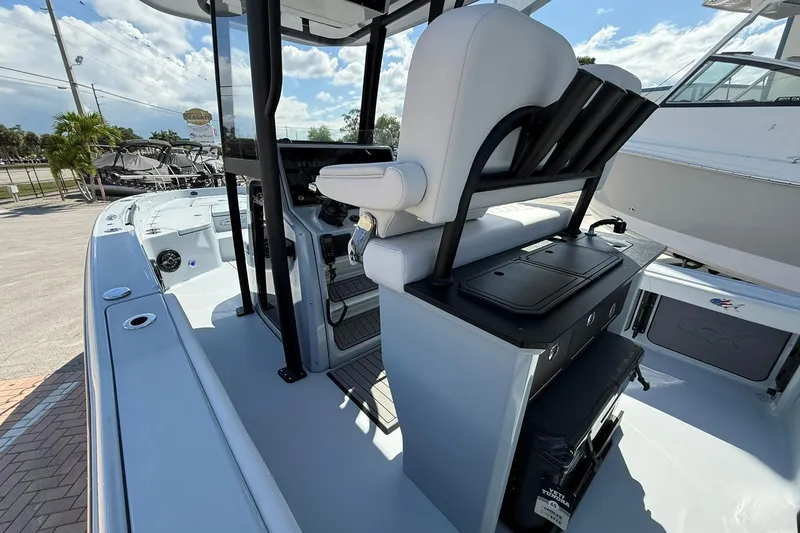 Slide: The Image of 2026 Crevalle 26 HCO boat interior with seating and console, showcasing modern design. - 28