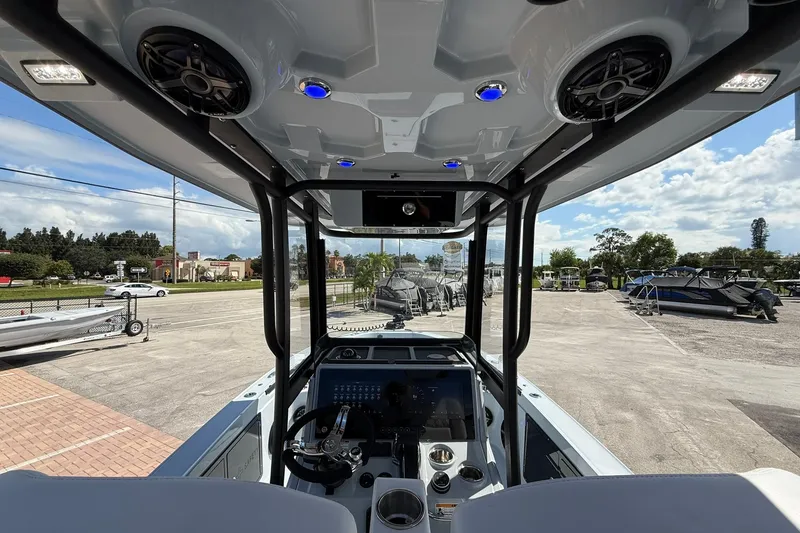 Slide: The Image of 2026 Crevalle 26 HCO boat interior with modern dashboard and overhead speakers. - 30