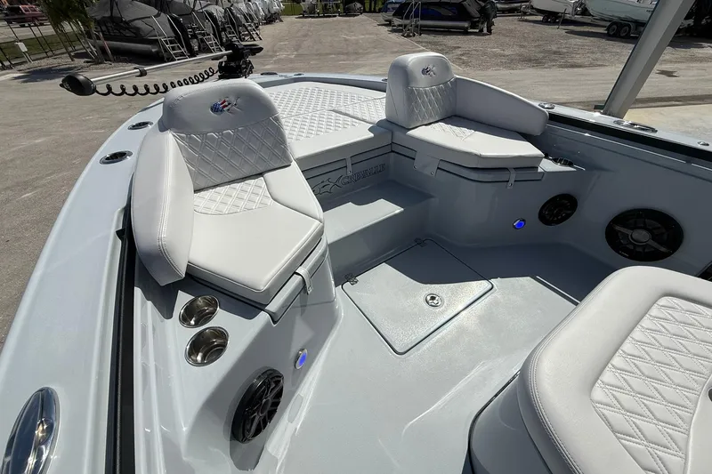 Slide: The Image of 2026 Crevalle 26 HCO boat interior with white cushioned seating and modern design. - 41