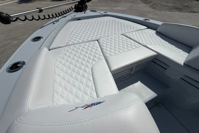 Slide: The Image of 2026 Crevalle 26 HCO boat with luxurious white diamond-stitched seating. - 42