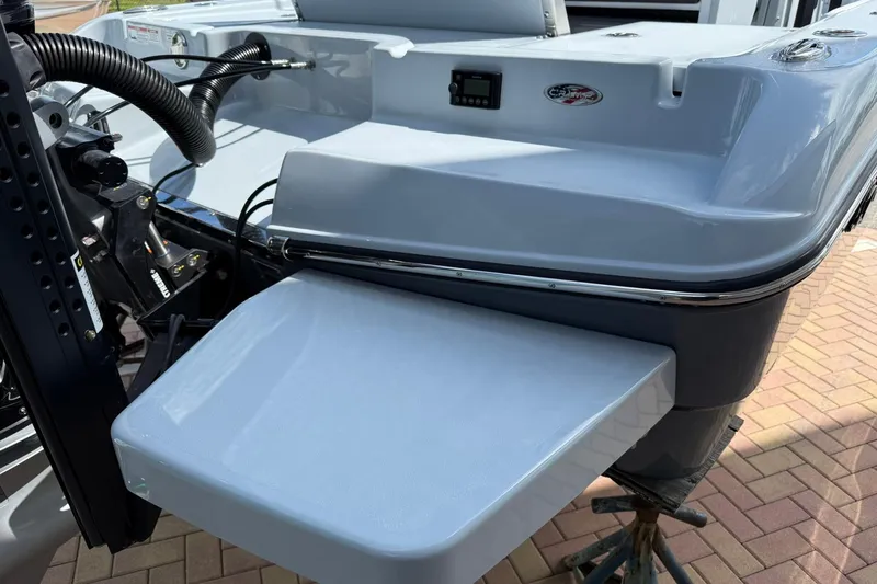 Slide: The Image of 2026 Crevalle 26 HCO boat stern with swim platform and motor components. - 5