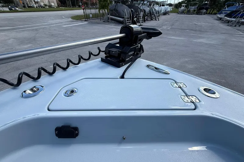 Slide: The Image of 2026 Crevalle 26 HCO boat deck with mounted equipment in a marina setting. - 52