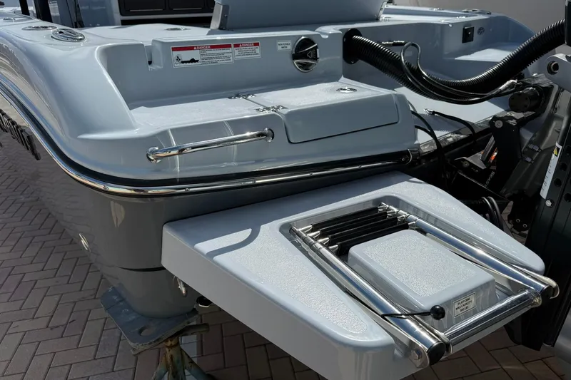 Slide: The Image of 2026 Crevalle 26 HCO boat stern with swim ladder and sleek design. - 6