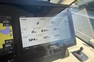 Slide: The Image of Dashboard of a 2021 Regal 38 XO boat displaying navigation and speed data. - 16