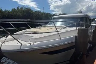 Slide: The Image of 2021 Regal 38 XO boat with Yamaha engines docked by a serene waterway. - 39