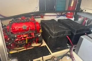 Slide: The Image of 2021 Regal 38 XO boat docked with triple outboard engines, surrounded by trees. - 41