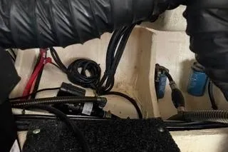 Slide: The Image of Engine room of 2021 Regal 38 XO boat with mechanical components and wiring. - 44