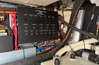 Slide: The Image of Engine compartment of 2021 Regal 38 XO boat, showcasing mechanical components and wiring. - 46