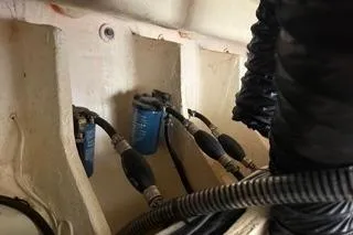 Slide: The Image of Engine room of 2021 Regal 38 XO boat, showcasing electrical components and wiring. - 49