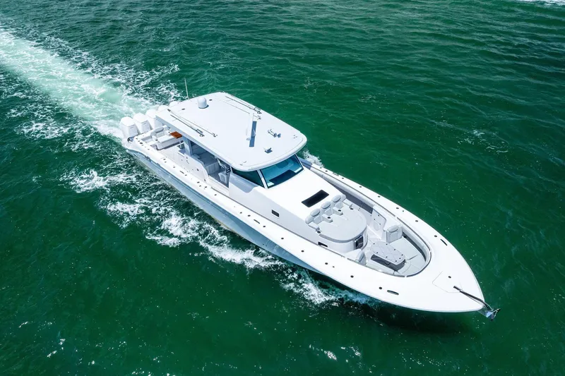 Slide: The Image of 2025 HCB 56 Suenos GIX luxury yacht cruising on open water. - 14