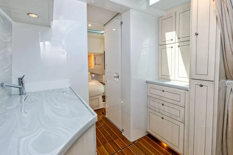 Slide: The Image of Luxurious interior of 2025 HCB 56 Suenos GIX yacht with modern cabinetry and sleek design. - 17