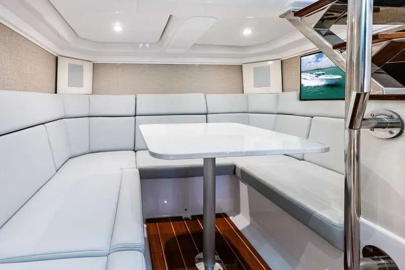 Slide: The Image of Luxurious interior of 2025 HCB 56 Suenos GIX yacht with elegant seating and table. - 19