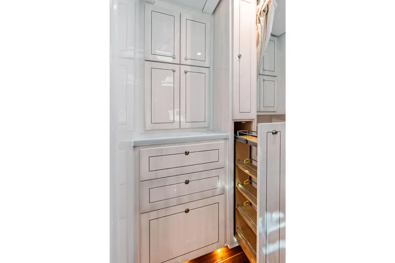 Slide: The Image of Luxurious cabinetry in the 2025 HCB 56 Suenos GIX yacht interior, featuring sleek storage solutions. - 24