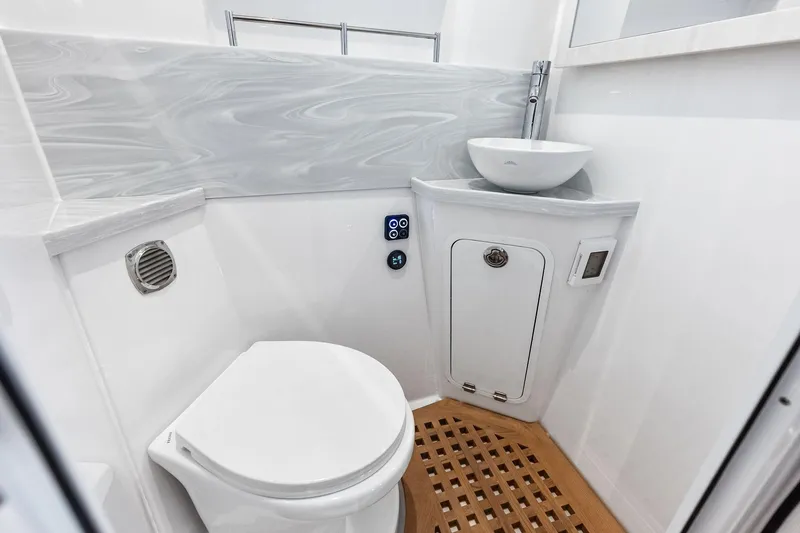 Slide: The Image of Luxurious bathroom in 2025 HCB 56 Suenos GIX yacht with modern fixtures and wooden flooring. - 29