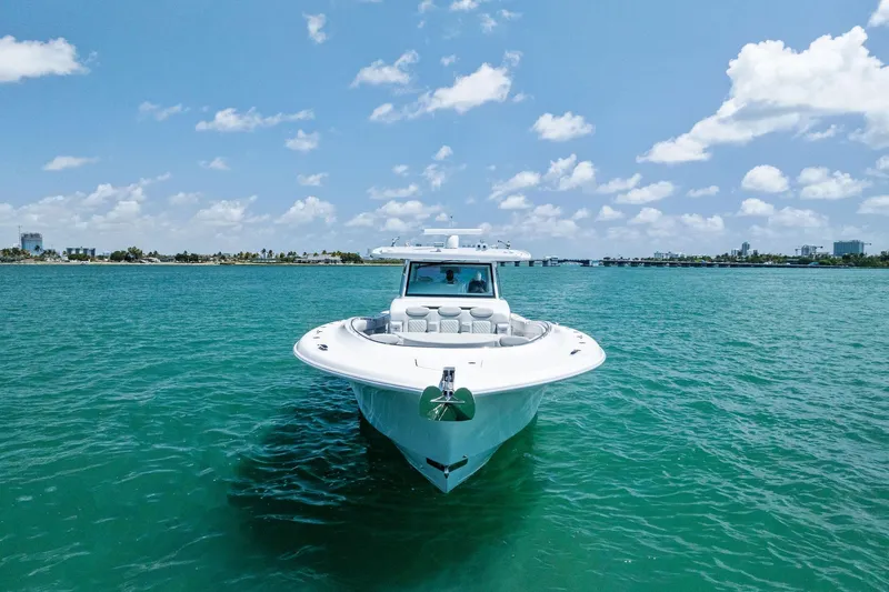 Slide: The Image of 2025 HCB 56 Suenos GIX yacht on clear blue water under a sunny sky. - 3