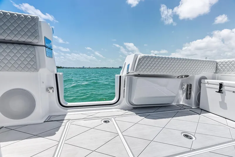 Slide: The Image of 2025 HCB 56 Suenos GIX boat interior with luxurious seating and ocean view. - 36