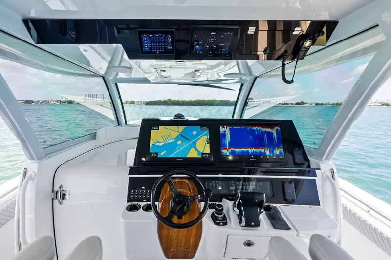 Slide: The Image of Helm of 2025 HCB 56 Suenos GIX with advanced navigation displays and controls. - 38