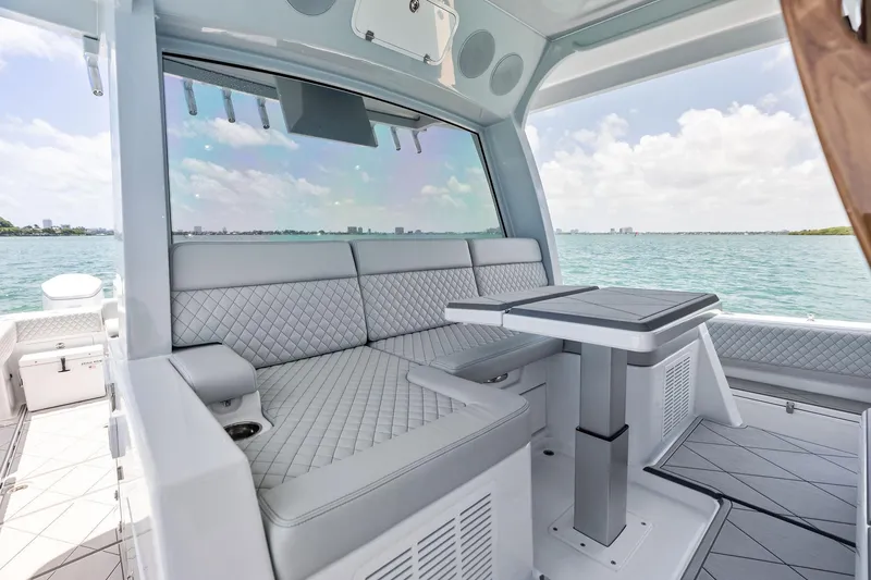 Slide: The Image of Luxurious interior of 2025 HCB 56 Suenos GIX yacht with elegant seating and table. - 39