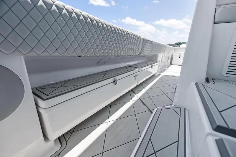 Slide: The Image of 2025 HCB 56 Suenos GIX boat interior with sleek seating and storage. - 43