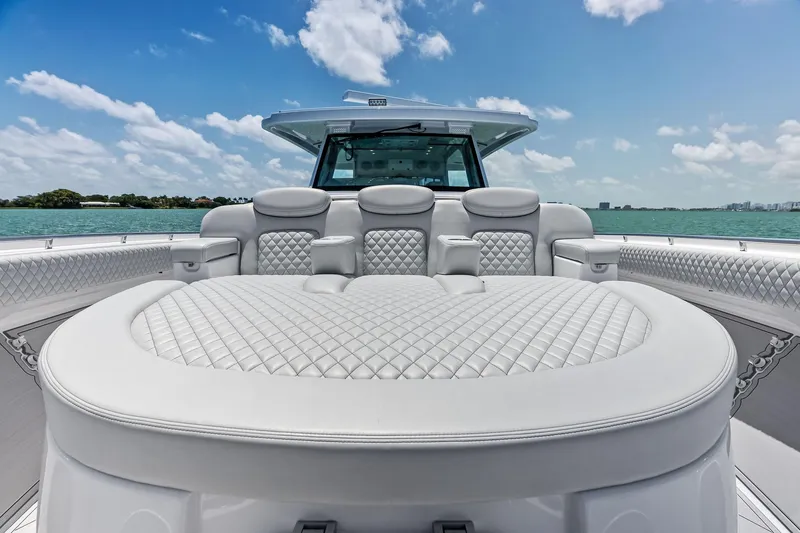 Slide: The Image of Luxurious seating on 2025 HCB 56 Suenos GIX yacht, featuring quilted upholstery and ocean view. - 47