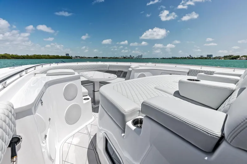 Slide: The Image of Luxurious 2025 HCB 56 Suenos GIX yacht interior with plush seating and ocean view. - 49