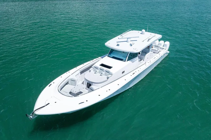 Slide: The Image of 2025 HCB 56 Suenos GIX luxury yacht on clear turquoise water. - 5