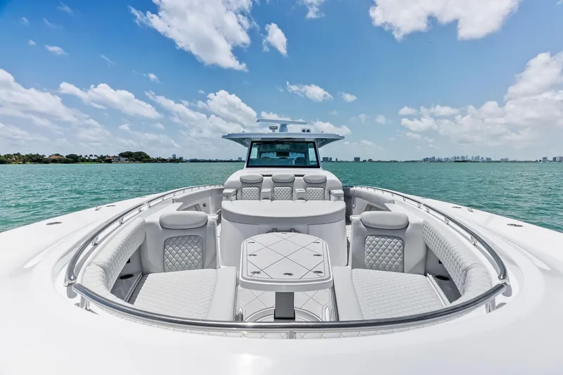 Slide: The Image of Luxury 2025 HCB 56 Suenos GIX yacht on serene water under blue sky. - 52